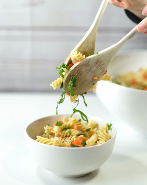 wooden spoons serving pasta salad